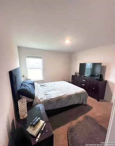 a bedroom with furniture and a bed