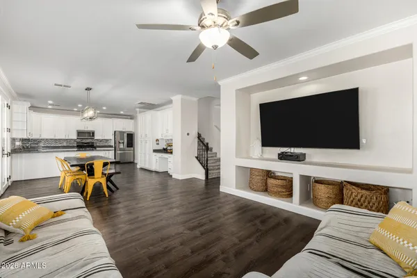 a kitchen with stainless steel appliances granite countertop a sink a stove a microwave and cabinets