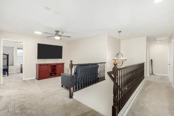 a bathroom with a granite countertop double vanity sink and a mirror