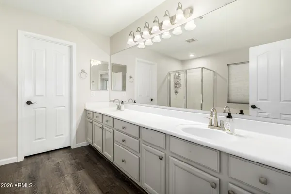 a spacious bedroom with a bed and a walk in closet