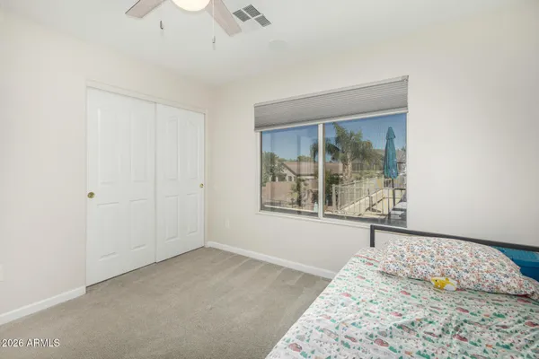 a front view of a house with a garden and plants