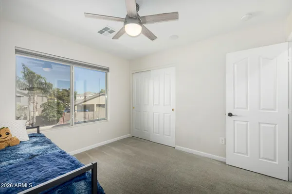 a view of a backyard with sitting area