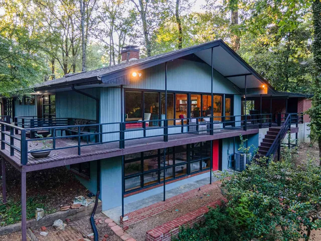 a view of a chairs and table in patio