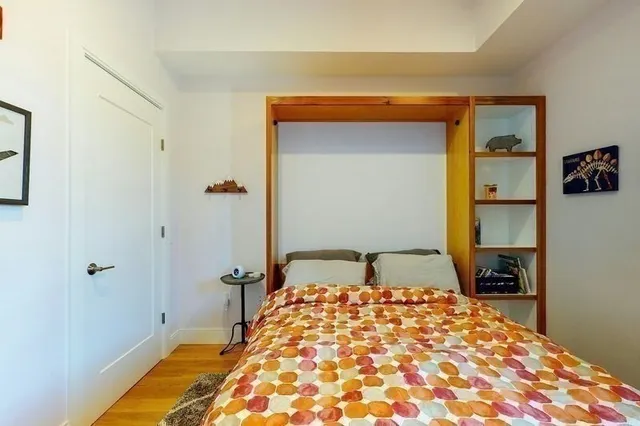a white toilet sitting next to a bathroom sink