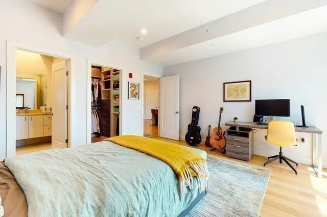 a bed room with a bed and a view of bathroom