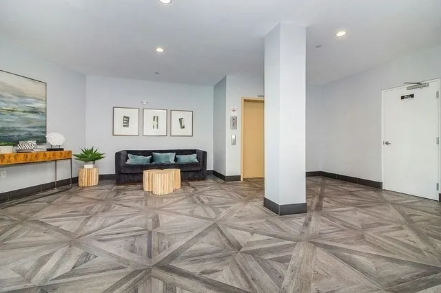 a view of a patio with table and chairs and potted plants