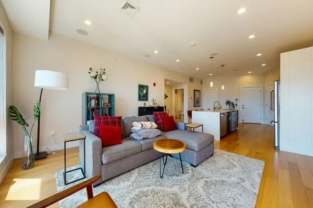 a living room with furniture and a table