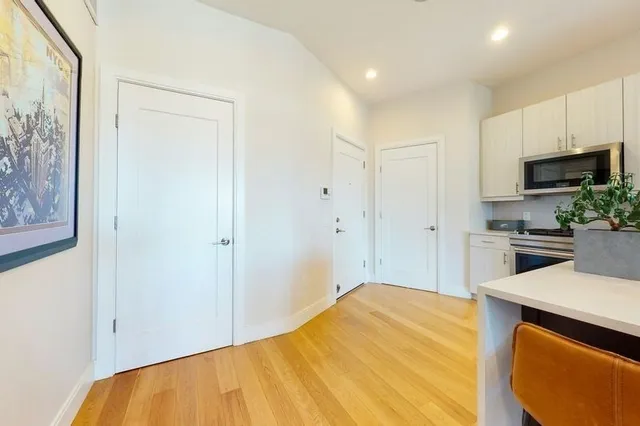 a view of kitchen with wooden floor
