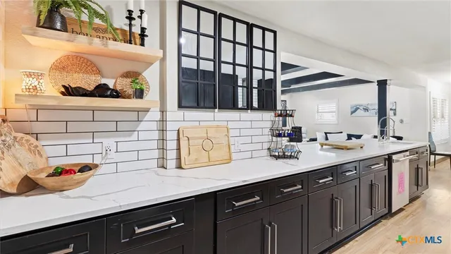a kitchen with a sink and a window