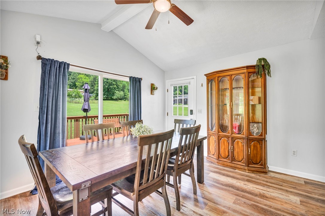 3005 Kendall Road Akron, OH 44321 - Photo 12 of 46 Dining area with lofted ceiling with beams, ceiling fan, and light hardwood / wood-style flooring