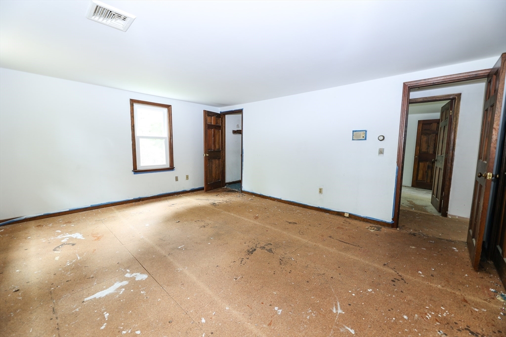 329 Woodside Road Barnstable, MA 02668 - Photo 12 of 26 an empty room with windows