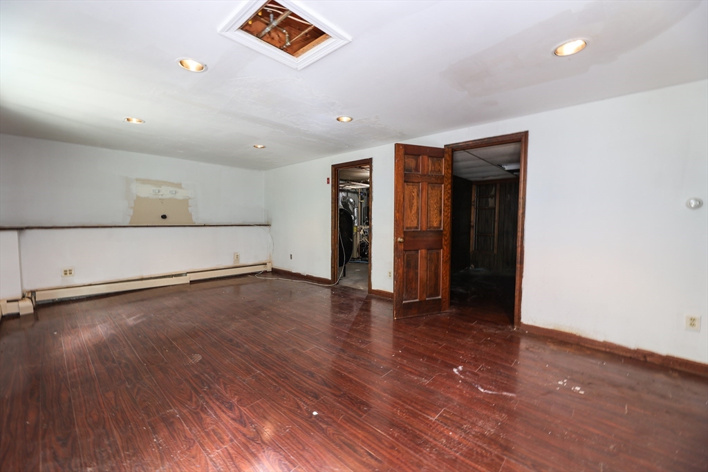 329 Woodside Road Barnstable, MA 02668 - Photo 17 of 26 an empty room with wooden floor and closet