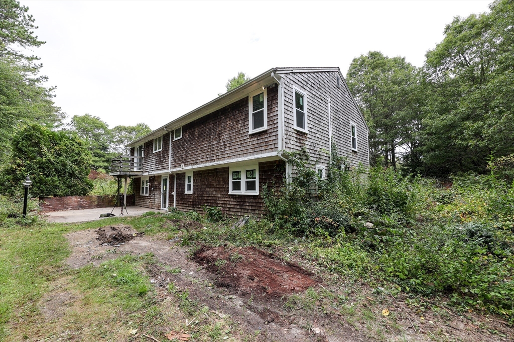 329 Woodside Road Barnstable, MA 02668 - Photo 2 of 26 a house view with a outdoor space