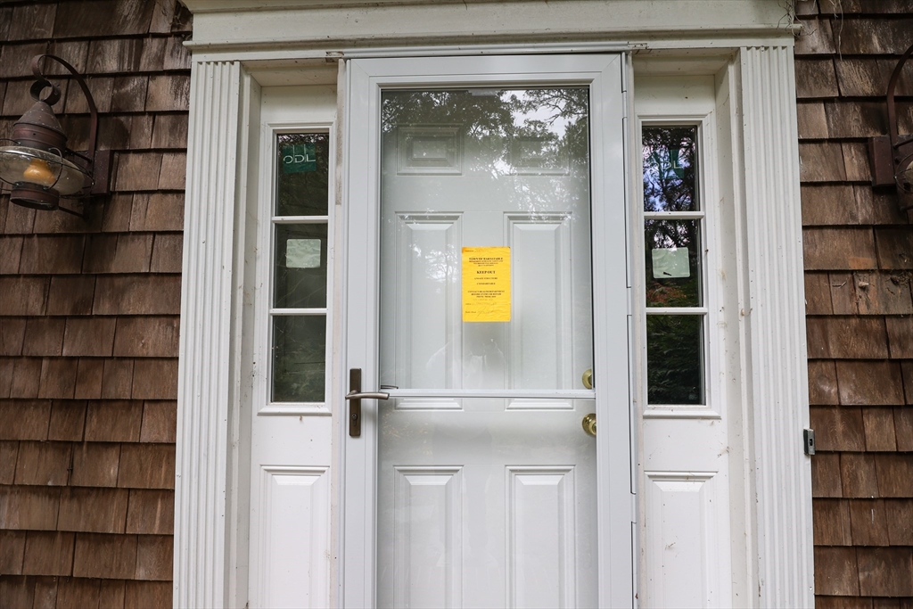 329 Woodside Road Barnstable, MA 02668 - Photo 24 of 26 a view of a door and a window