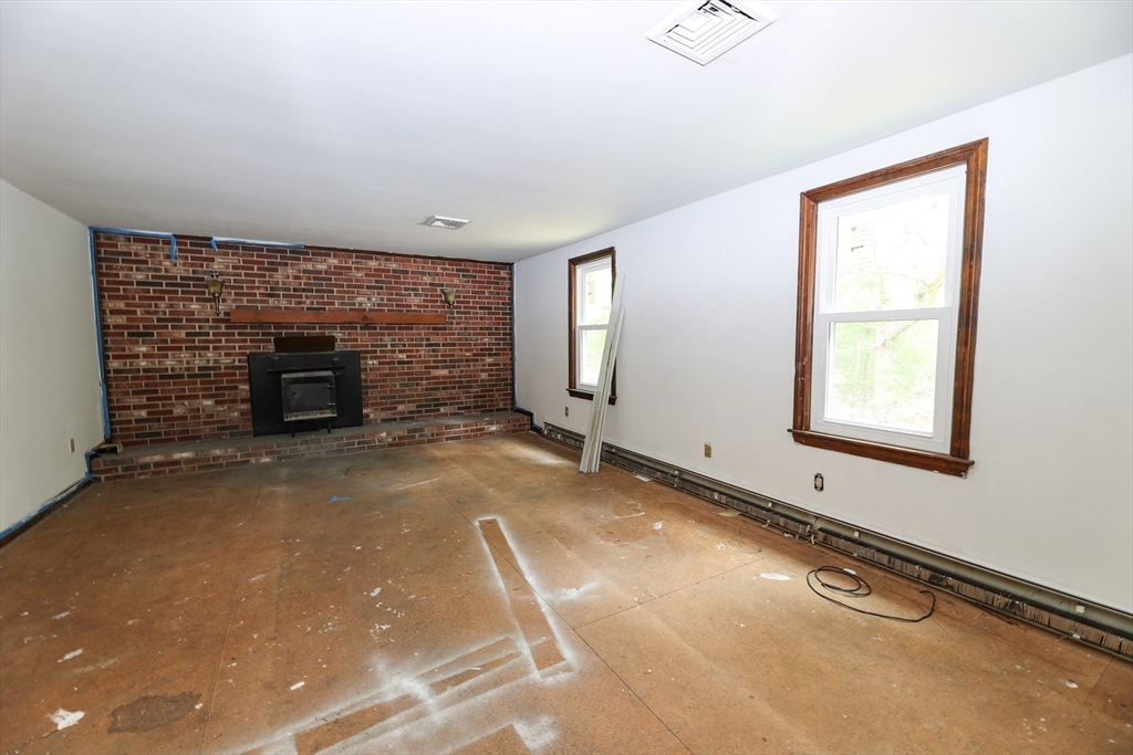 329 Woodside Road Barnstable, MA 02668 - Photo 3 of 26 an empty room with windows