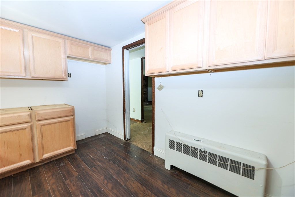 329 Woodside Road Barnstable, MA 02668 - Photo 5 of 26 a view of a kitchen with wooden floor