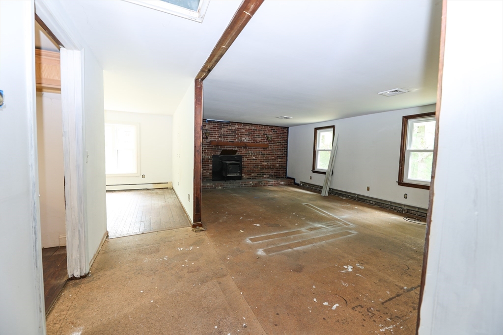 329 Woodside Road Barnstable, MA 02668 - Photo 7 of 26 a view of a livingroom with a staircase