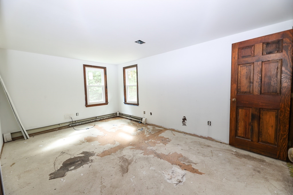 329 Woodside Road Barnstable, MA 02668 - Photo 10 of 26 an empty room with windows