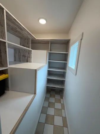 a view of an empty walk in closet