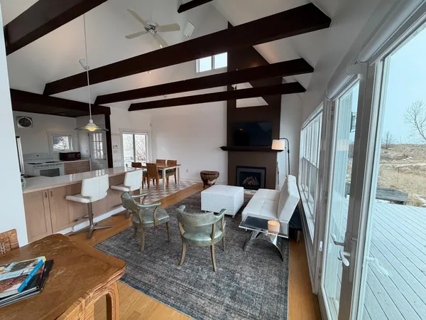 a dining room with furniture and a fireplace