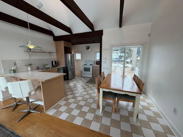 a dining room with a table and chairs