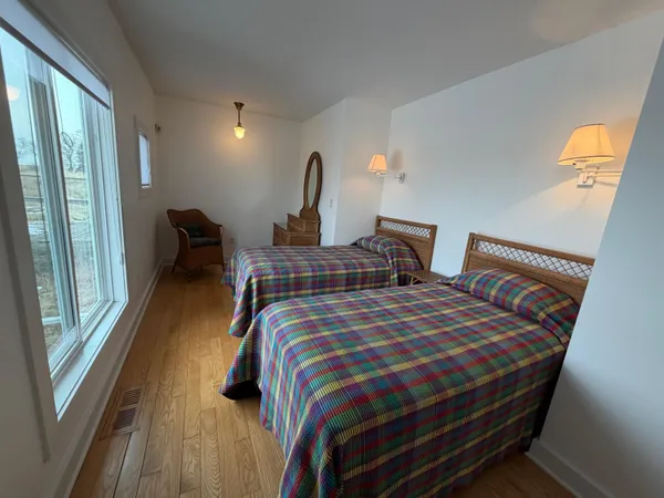 a bedroom with bed and balcony