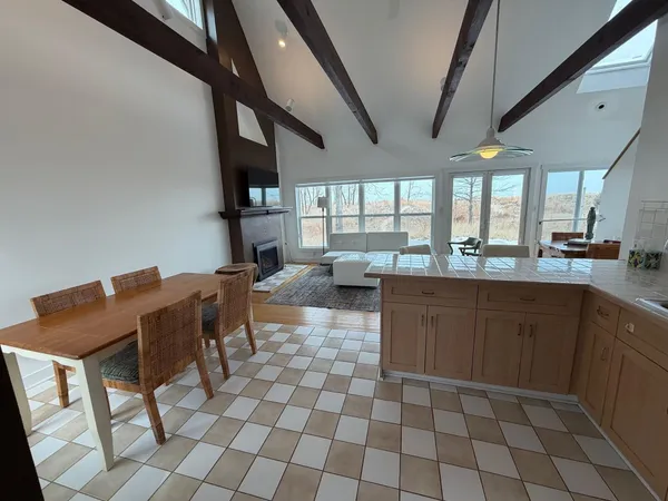 a kitchen with a dining table and chairs