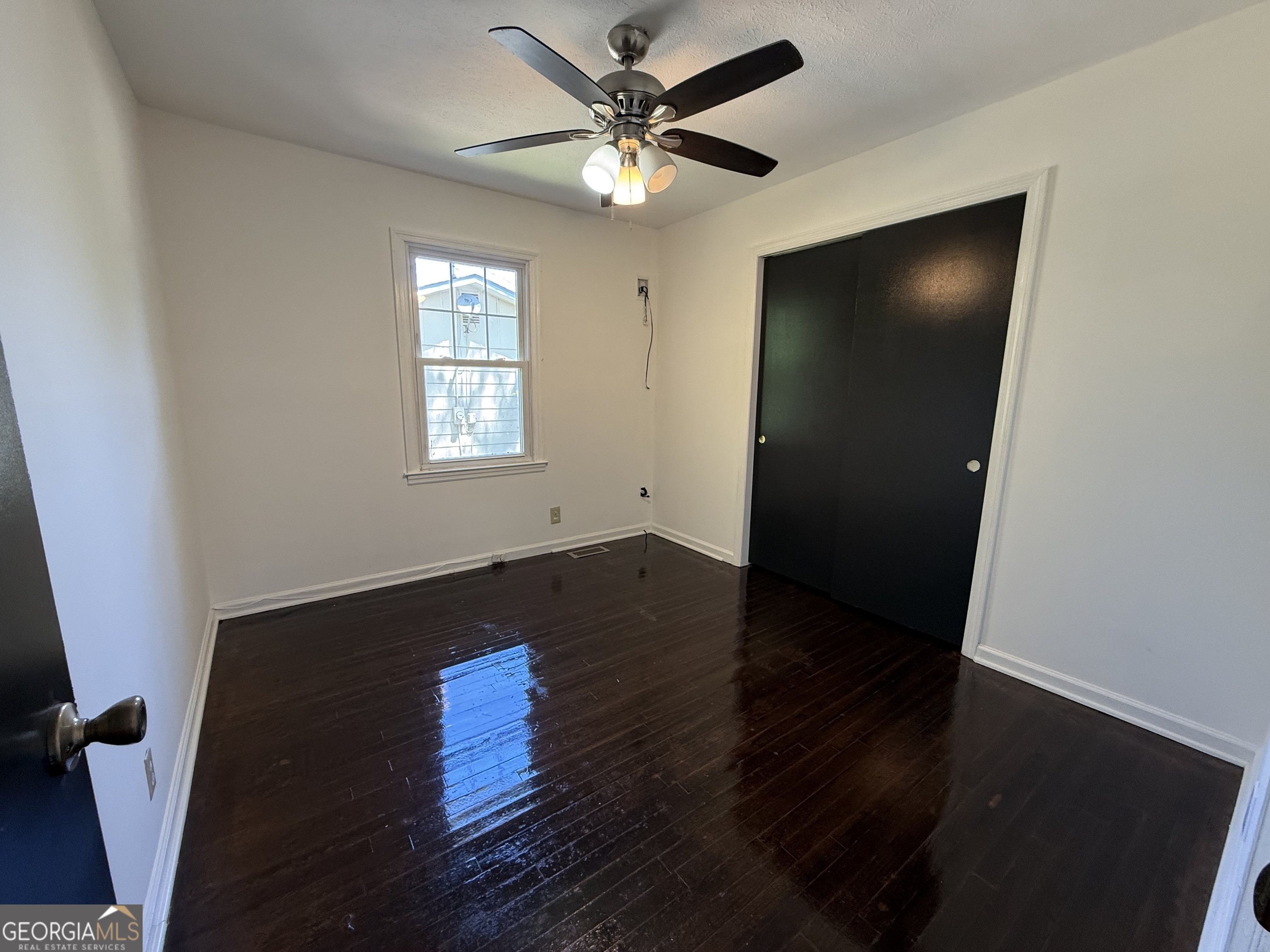 179 Youngs Mill Road LaGrange, GA 30241 - Photo 24 of 30 wooden floor in an empty room with a window