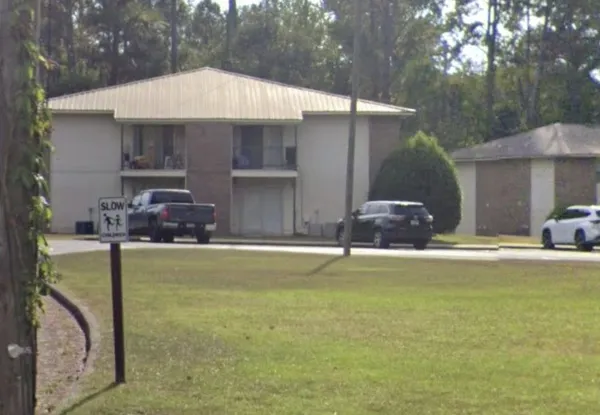 a front view of house with yard and outdoor seating