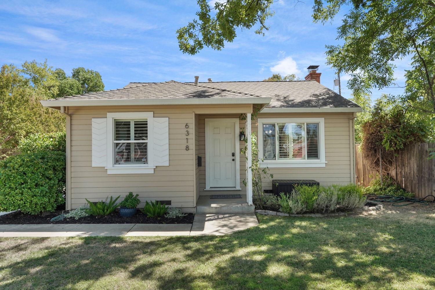 front view of a house with a yard
