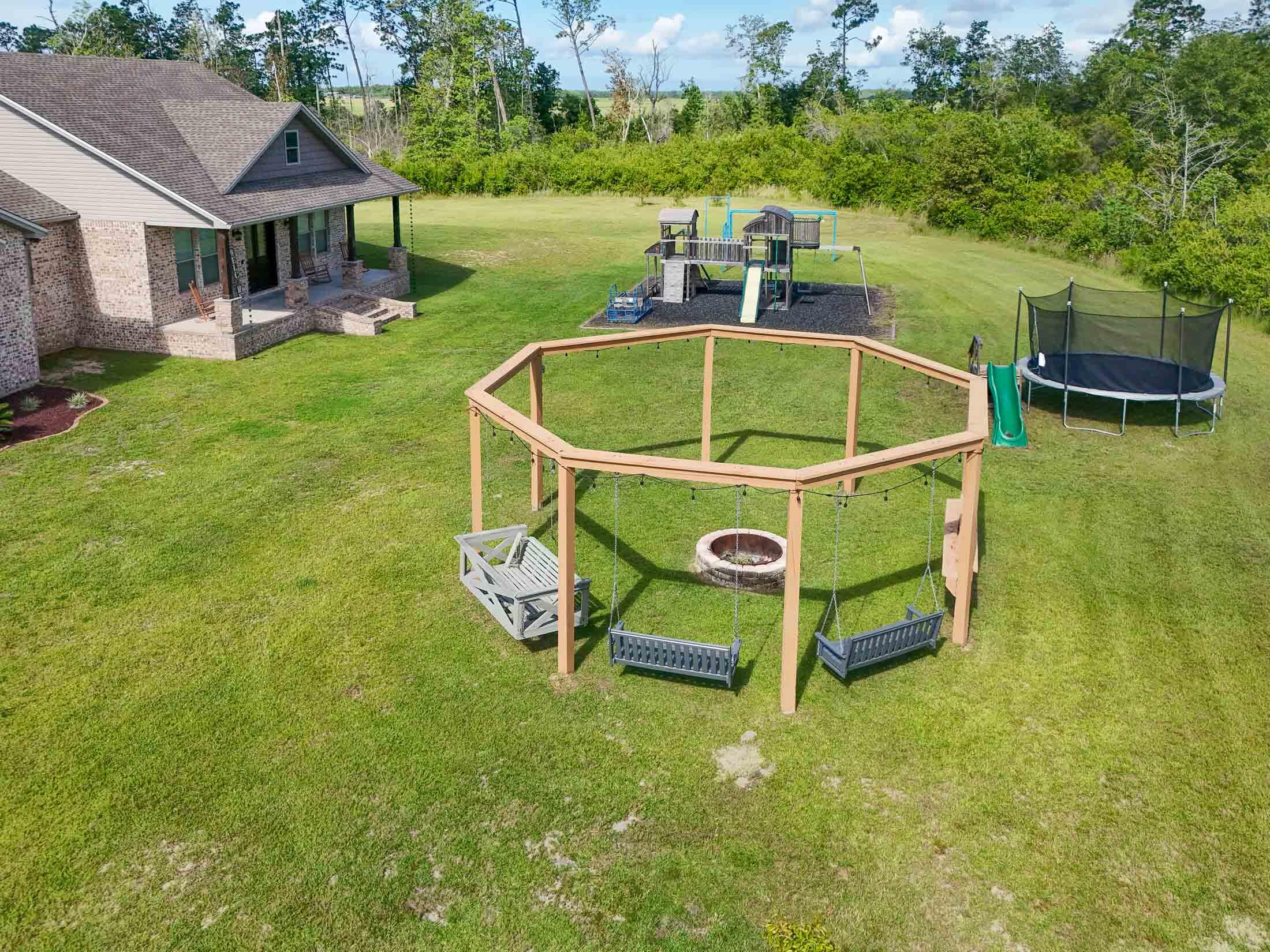 2750 Edwards Road Southport, FL 32409 - Photo 13 of 60 an aerial view of a house with swimming pool garden and outdoor seating