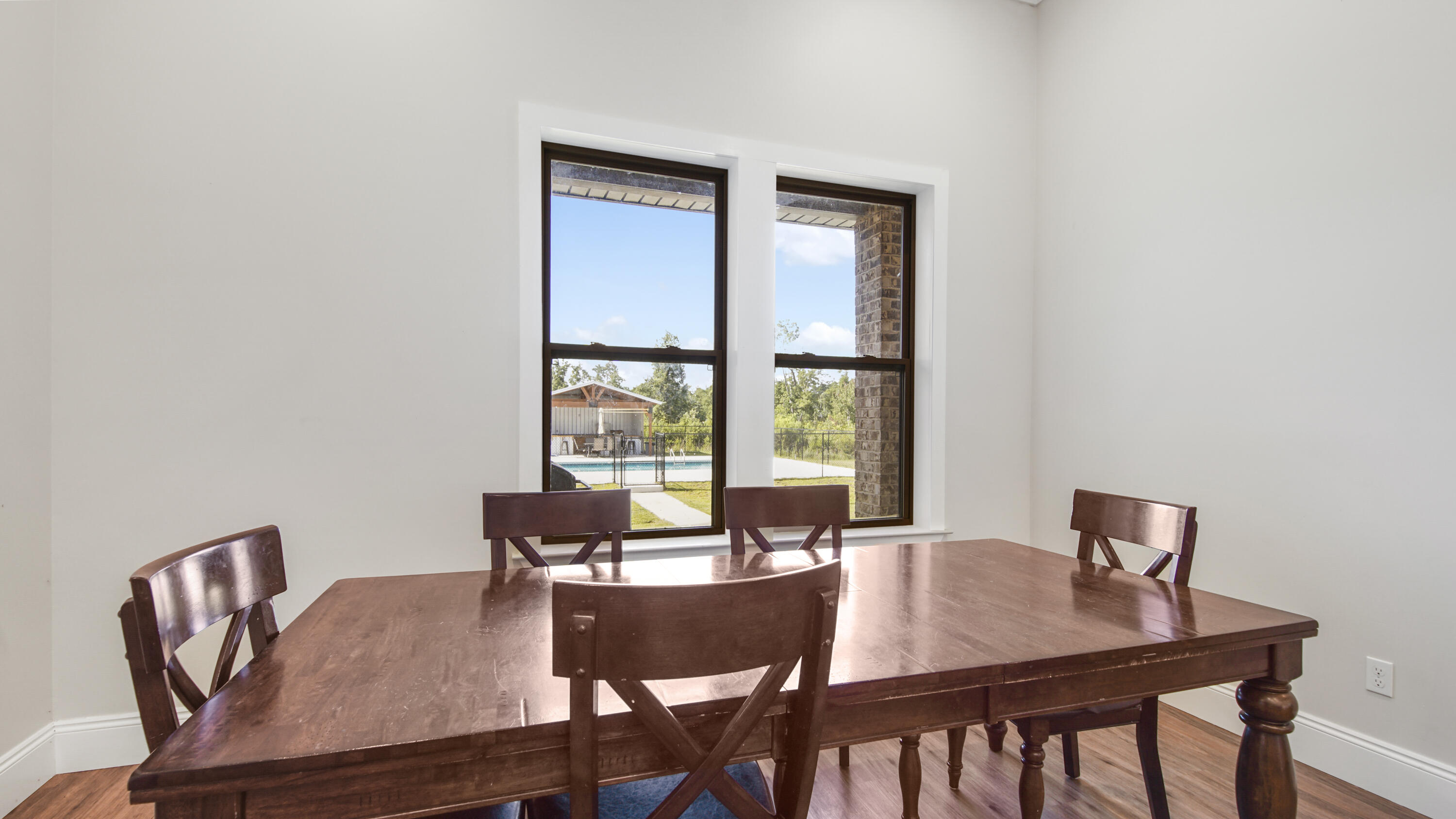 2750 Edwards Road Southport, FL 32409 - Photo 31 of 60 a view of a dining room with furniture and a window