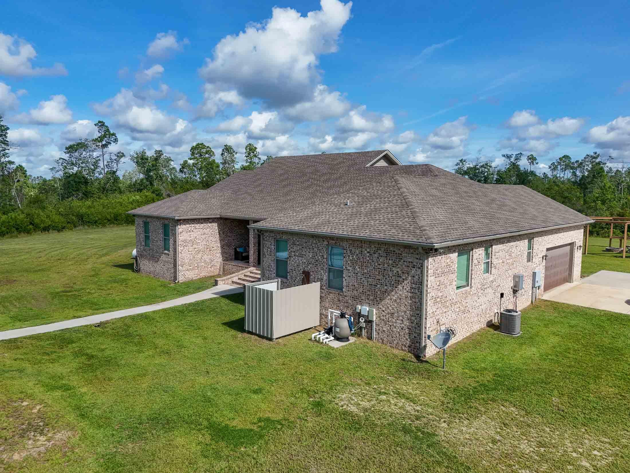 2750 Edwards Road Southport, FL 32409 - Photo 4 of 60 a view of a house with backyard and garden