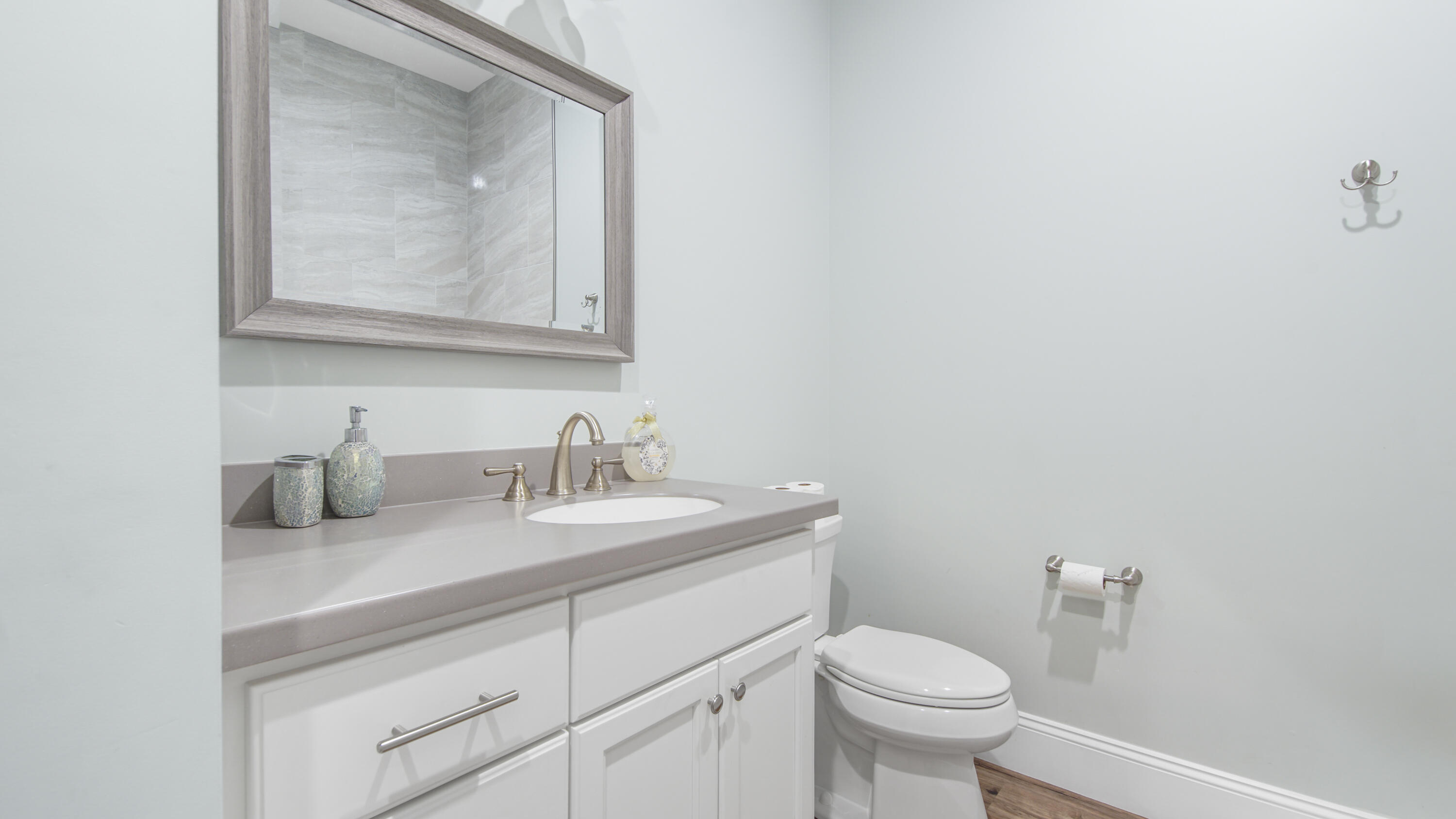 2750 Edwards Road Southport, FL 32409 - Photo 52 of 60 a bathroom with a toilet sink and mirror