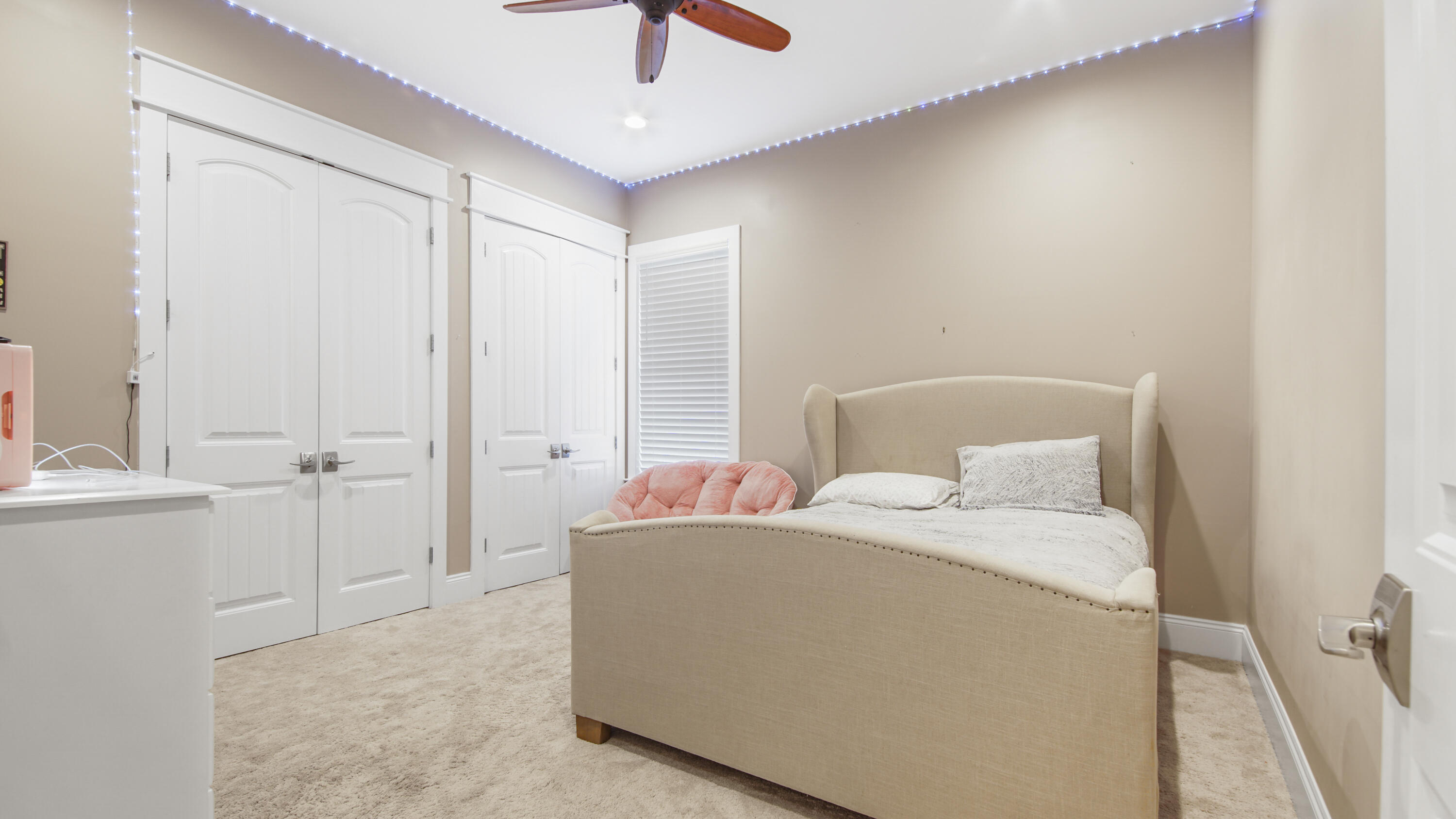 2750 Edwards Road Southport, FL 32409 - Photo 55 of 60 a bedroom with a bed and a chandelier