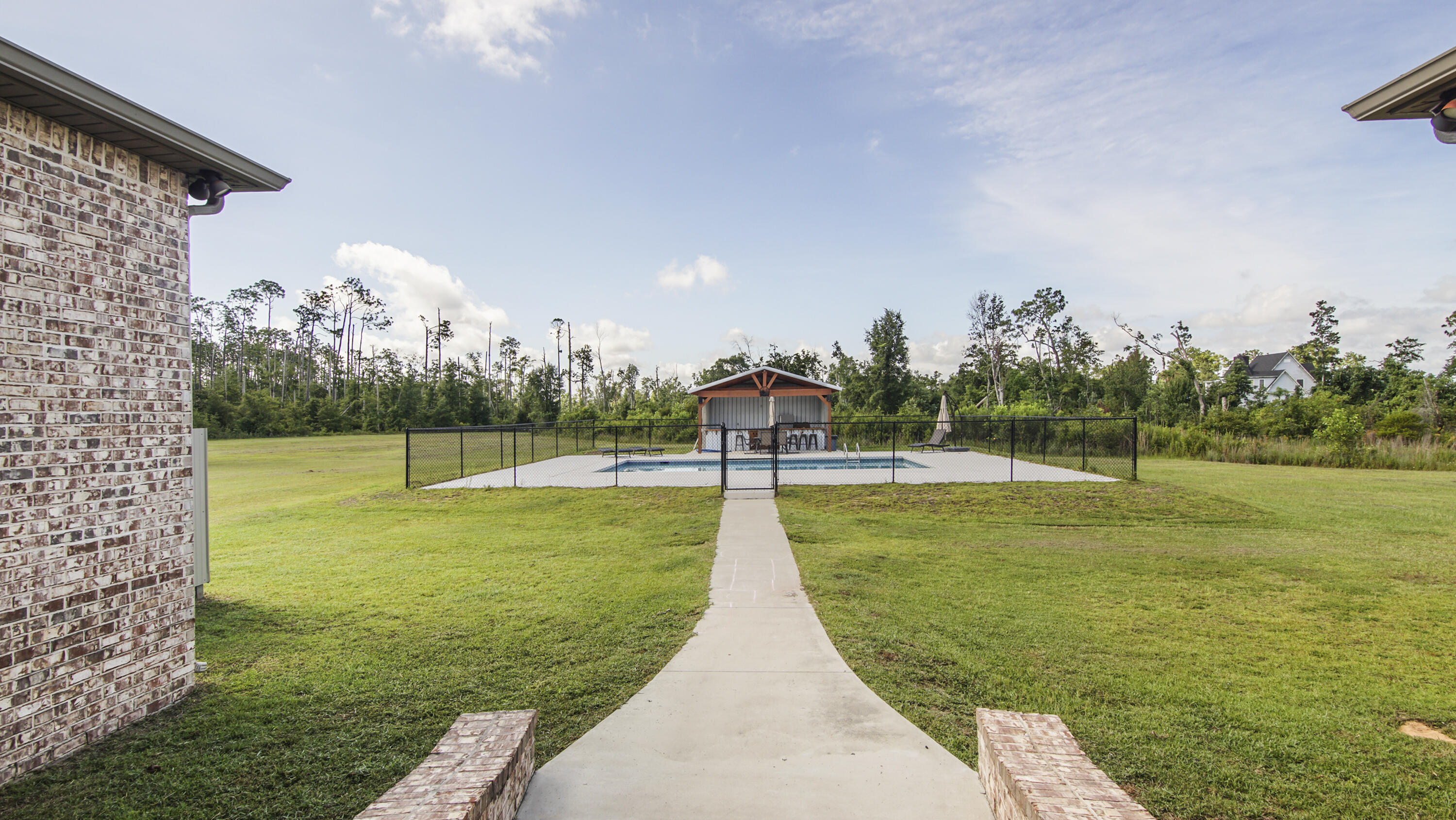 2750 Edwards Road Southport, FL 32409 - Photo 58 of 60 a view of a golf course with a lake view