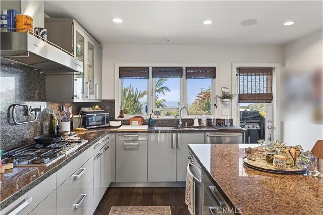 a bedroom with a bed and a dresser with mirror