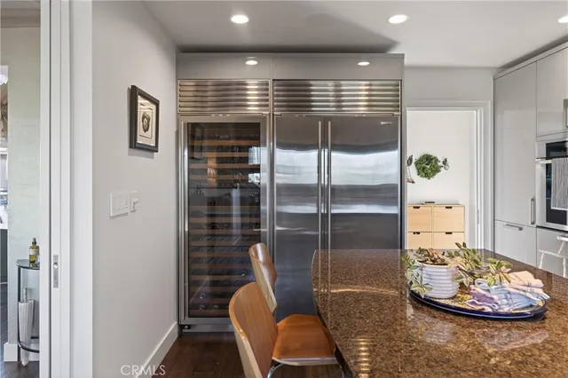 a bedroom with a bed and a chair