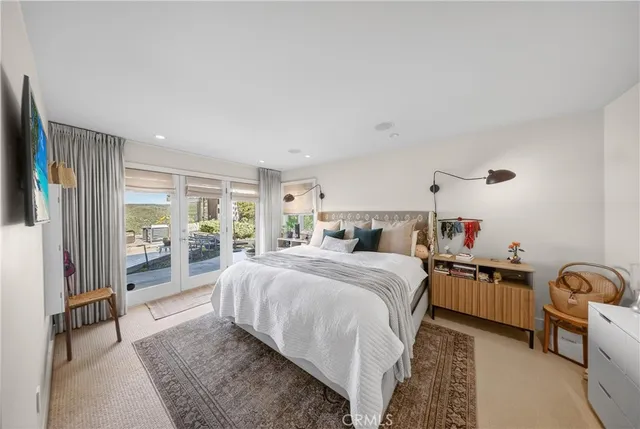 a bed room with a bed and a large window