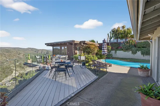 a view of a glass door with a view of mountain