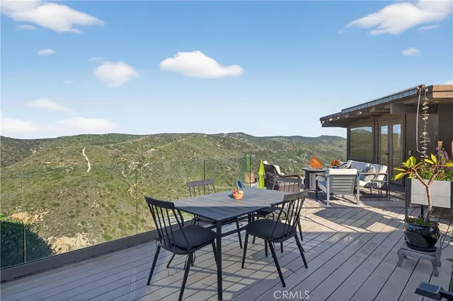 a view of a porch with furniture and a potted plants