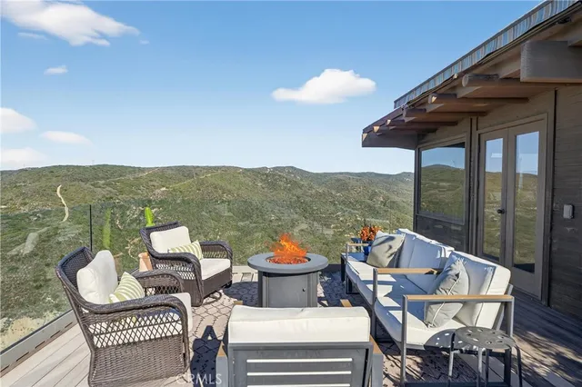 a view of swimming pool with outdoor seating and yard in back