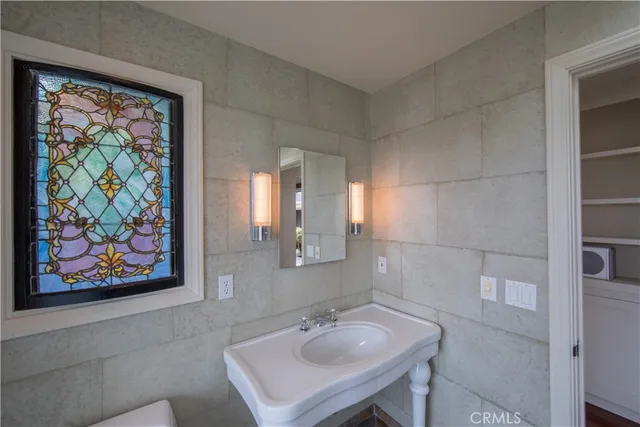 an aerial view of residential houses with outdoor space and parking