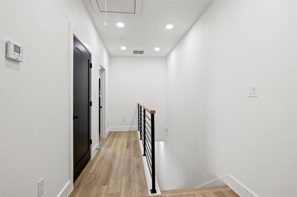 196 West 17th Street Mount Pleasant, TX 75455 - Photo 18 of 35 a view of hallway with wooden floor