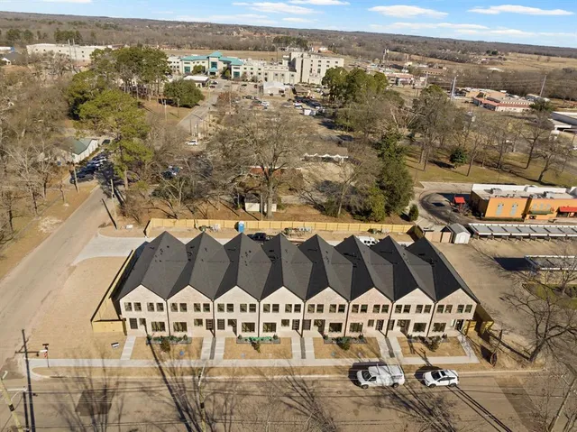 an aerial view of residential building with ocean view