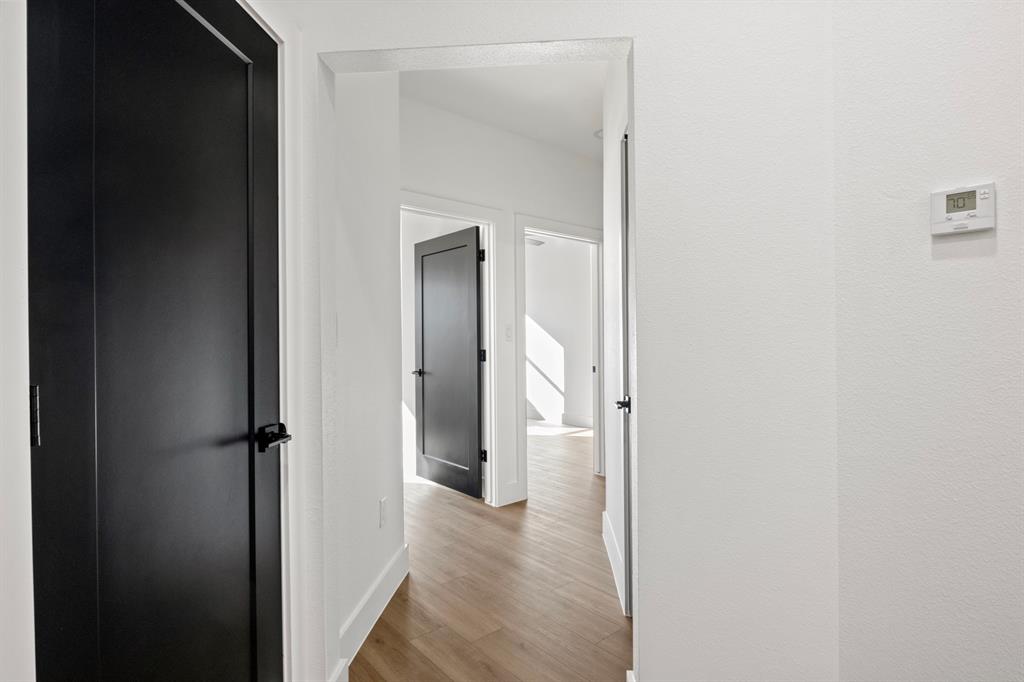 196 West 17th Street Mount Pleasant, TX 75455 - Photo 28 of 35 a view of a bathroom from a hallway
