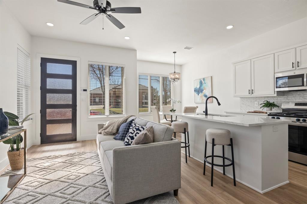 196 West 17th Street Mount Pleasant, TX 75455 - Photo 8 of 35 a living room with furniture and a large window