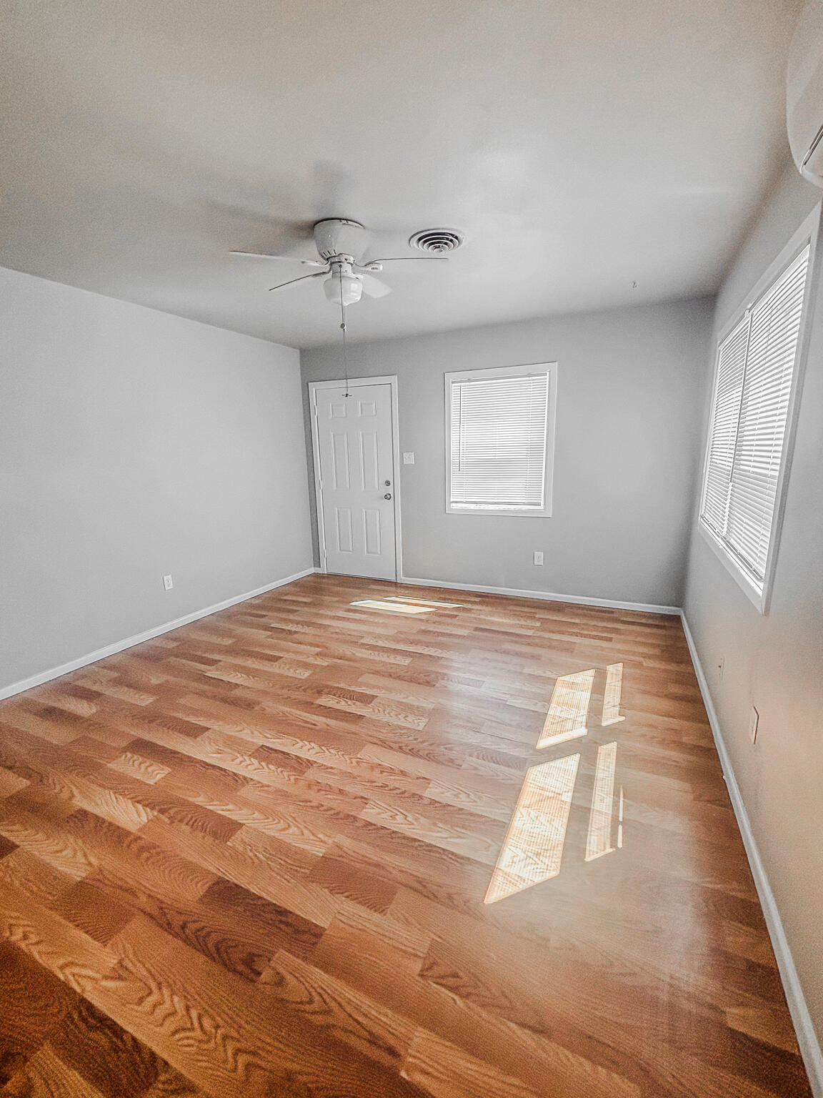 505 East 37th Street Lubbock, TX 79404 - Photo 13 of 25 a view of empty room with wooden floor and fan
