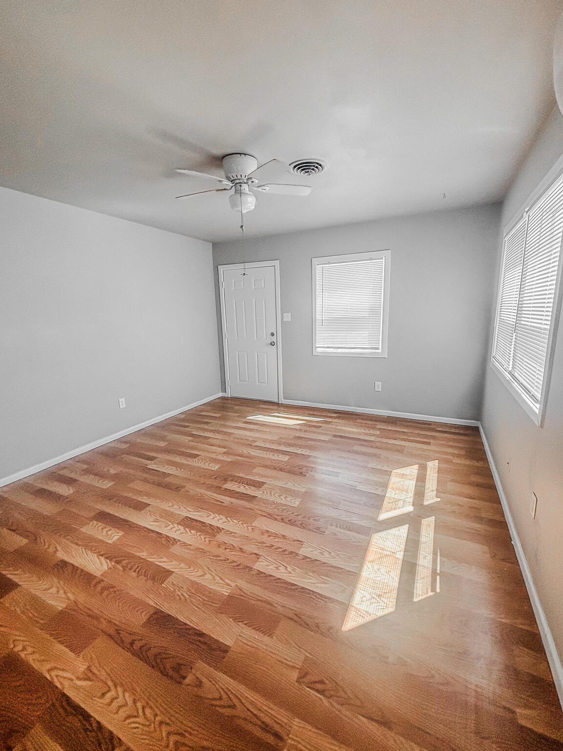 505 East 37th Street Lubbock, TX 79404 - Photo 14 of 25 a view of empty room with wooden floor and fan