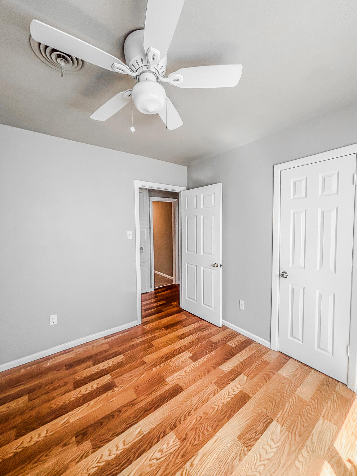 505 East 37th Street Lubbock, TX 79404 - Photo 17 of 25 a view of a livingroom with wooden floor and ceiling fan